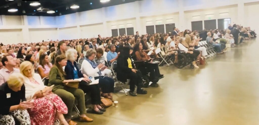 Audience members and new CPAs listen to a speaker during the June 2026 CPA ceremony