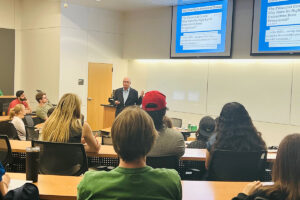 Image of Richard M. Bowen speaking to a group of accounting students at the University of North Texas.