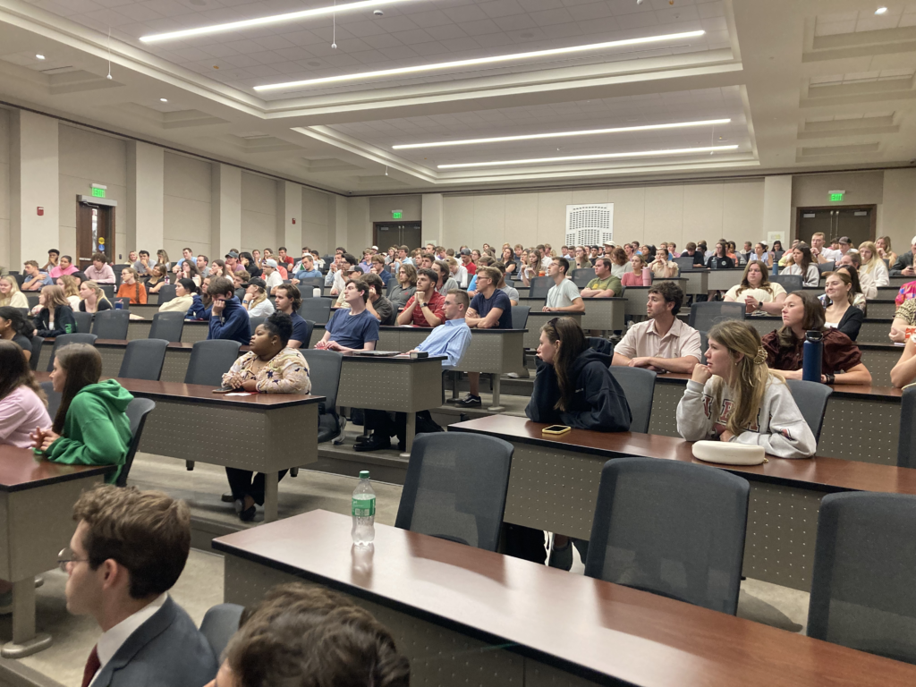 Students in a large classroom listen at a Richard M Bowen talk