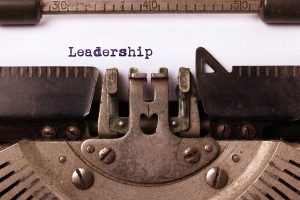 Typewriter with the word "Leadership" typed on an otherwise white page